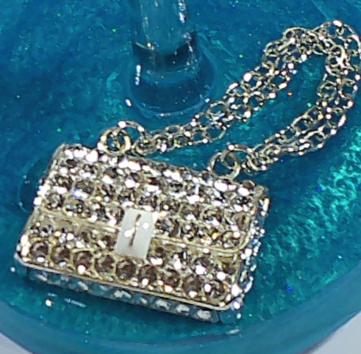 0090 Wine glass with gold rhinestone handbag on teal